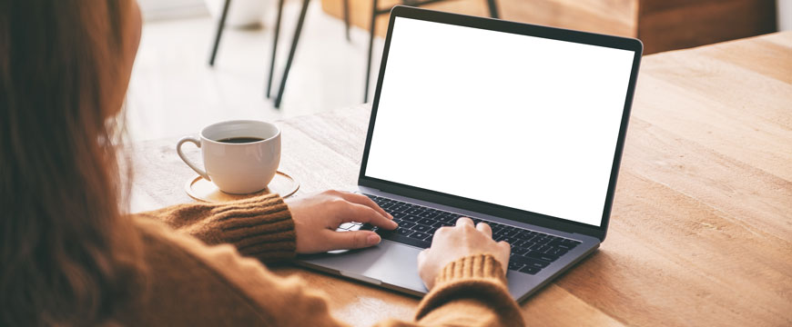 Persons Hands on a Computer