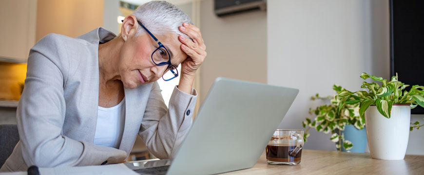 Woman Looking at Computer is Disbelief 
