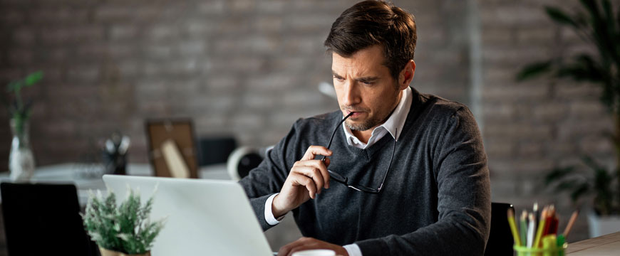 Guy on a Computer in Confusion