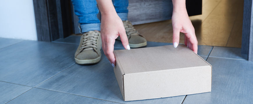 Person grabbing package off the porch
