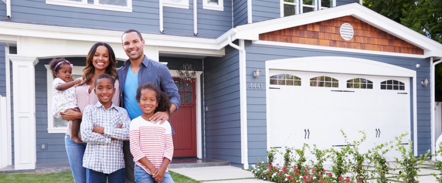 Family in front of house